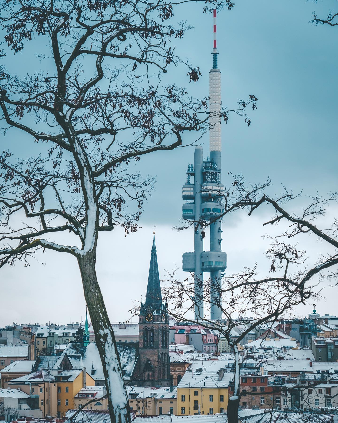 Structures 🗼⛪️☃️ #ThisisPrague #snow #zizkov #tvtower #churchtower #rooftops #whiterooftops #czech #praha #winter #chasingsnowflakes